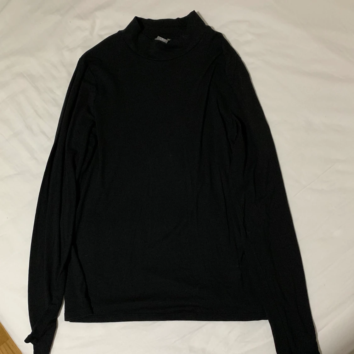 Svart polotröja från Lindex