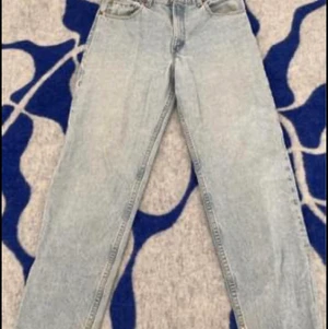 Levis 550 W34 - Den är uppsydd till en L30. Relaxed fit, Tapered leg