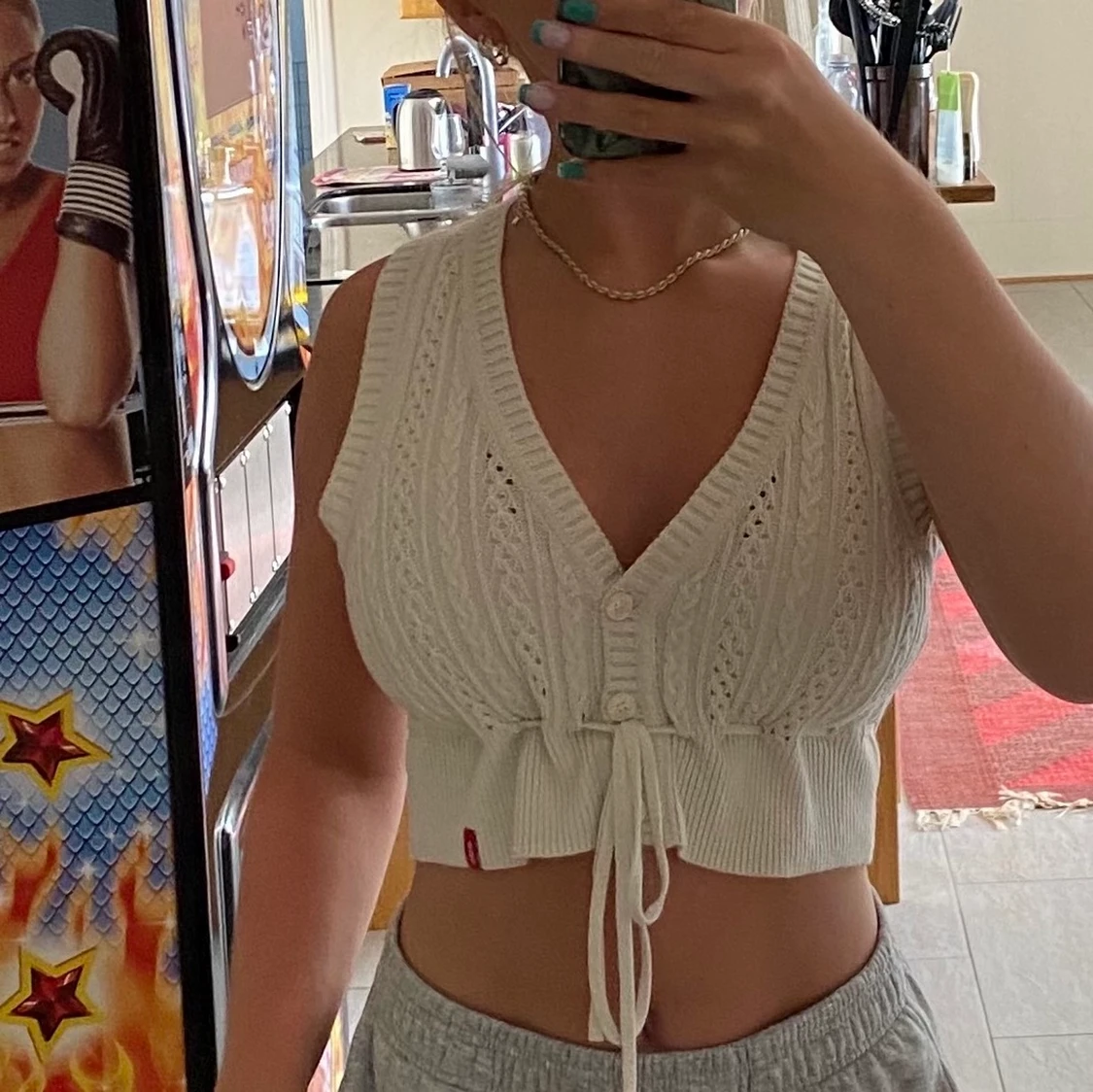 Stickad väst med knyte i midja - 91