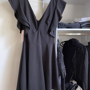 Vacker klänning i Uk size 10 - Prislappen är kvar 