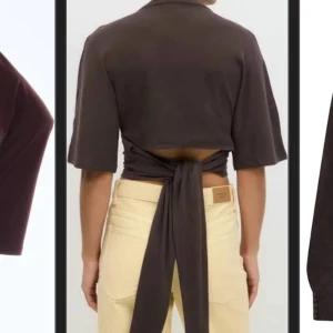 Brun croppad topp med knyt från 157 - Säljer en brun croppad topp från 157 med korta ärmar och långa knytband i midjan som ger en snygg omlott-effekt baktill. Toppen är i mjuk bomull och har en enkel rund halsringning. Perfekt för dig som gillar trendiga detaljer och vill ha en unik twist på din outfit.