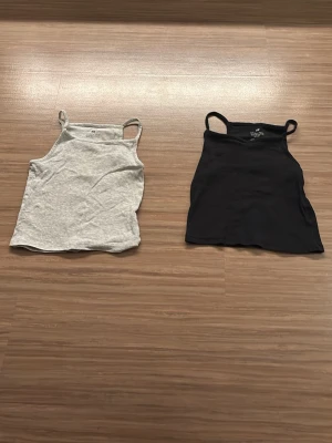 Svart och grå ribbad linne från H&M - Två enkla linnen med smala axel band. Bomulls material och är väldigt bra linne till sommaren. Kunde bara lägga till en färg men det är även en ljus grått linne 