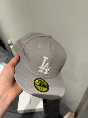 LA new era gray cap 7 1/8 - Size 7 1/8. Brand new