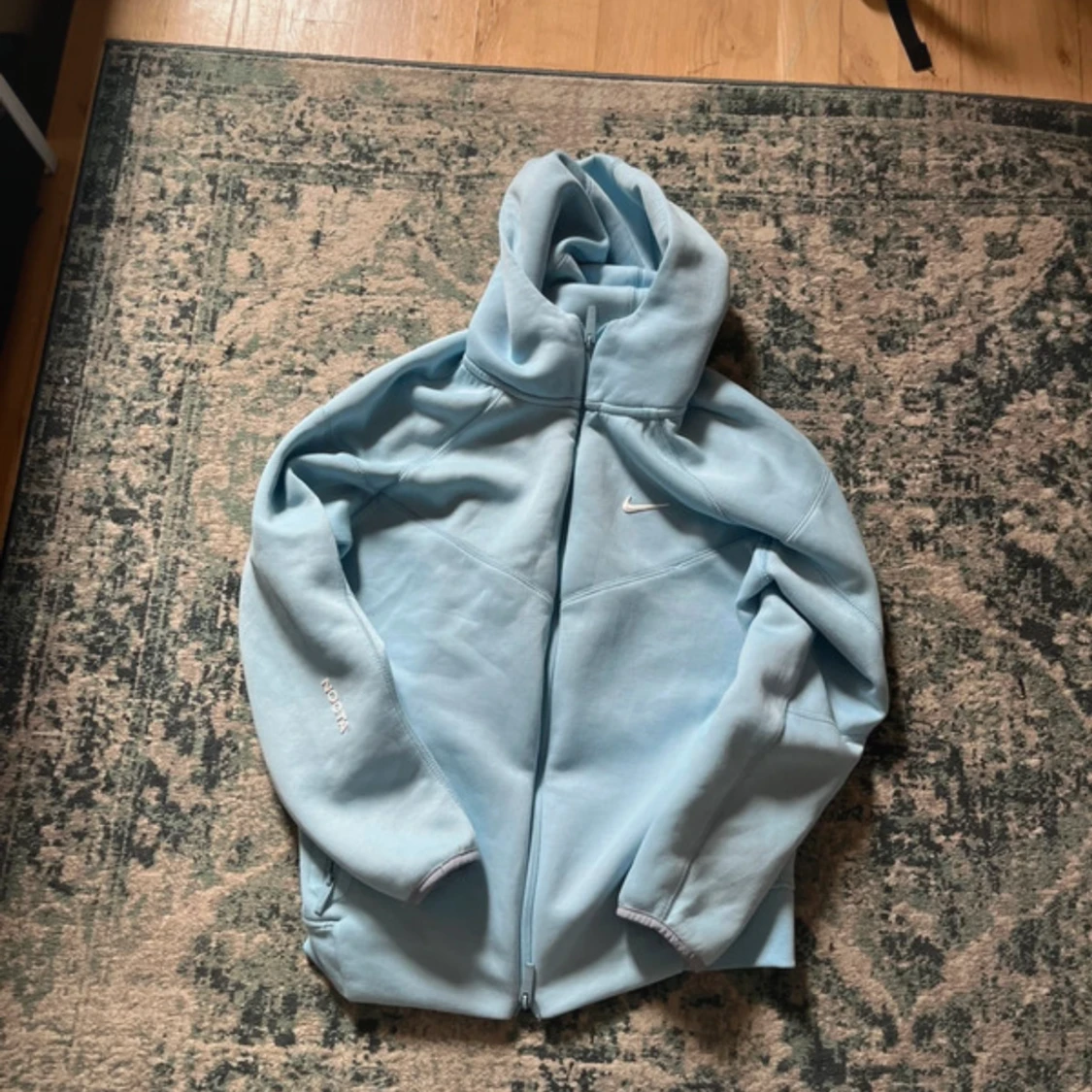 Ljusblå Nike NOCTA hoodiejacka