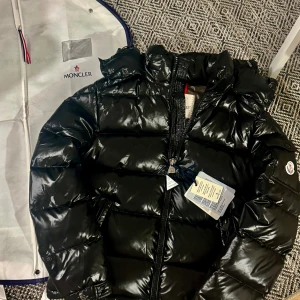 Moncler Maya Puffer Jacket Size 2 - In excellent condition with garment bag.                        Top quality. No sign of use. Fits S/M. Very thick. Fast shipping. 
