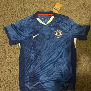 Chelsea fotbollströja 25/26 - Storlek M
