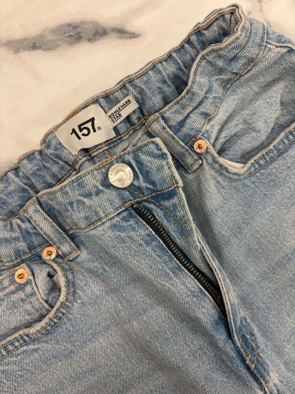 Ljusblå jeans med hål från 157 - 1