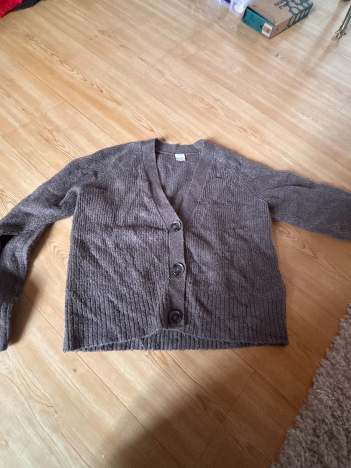 Brun kofta från Lindex med knappar