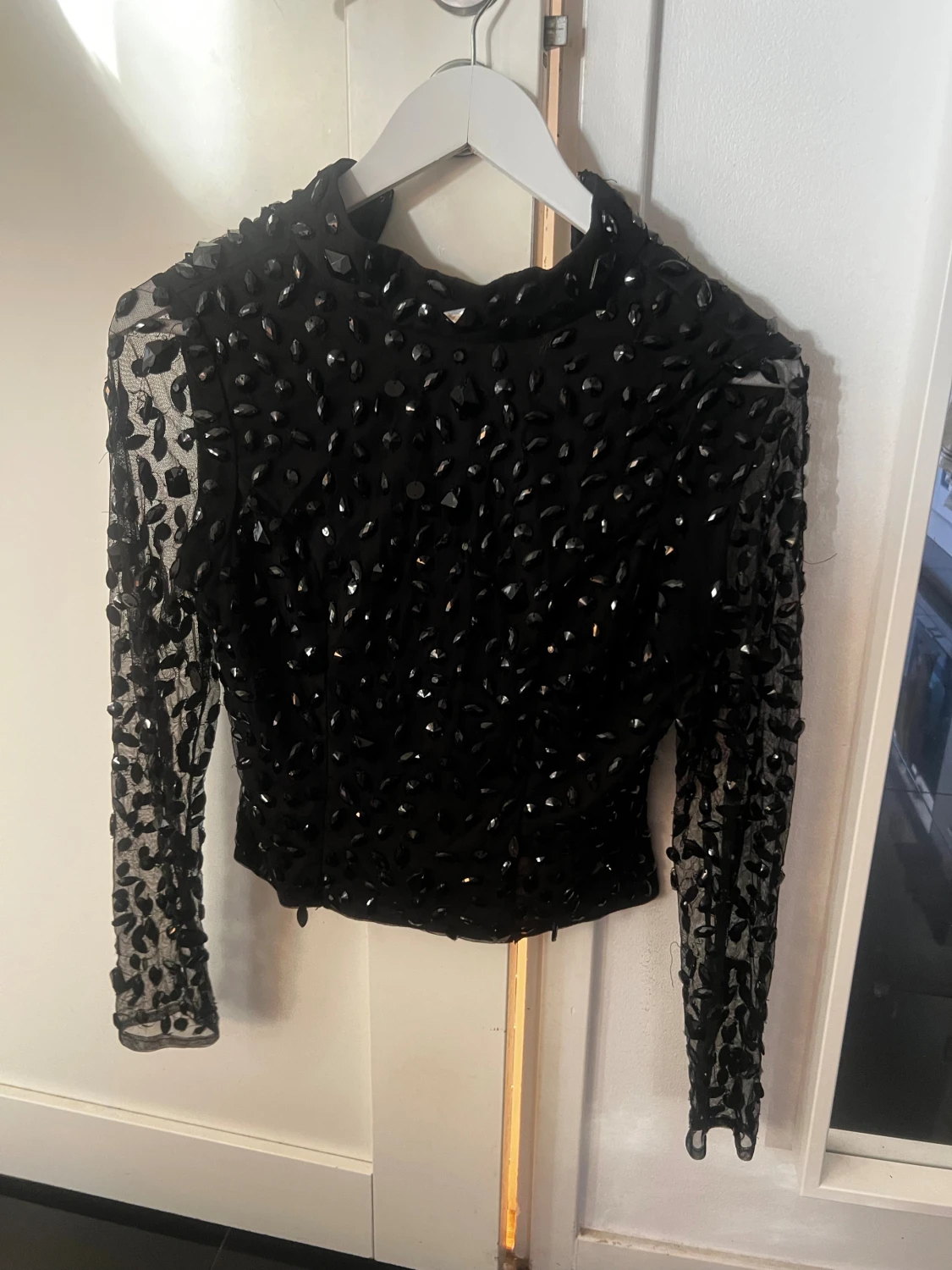 Svart glittrig långärmad topp