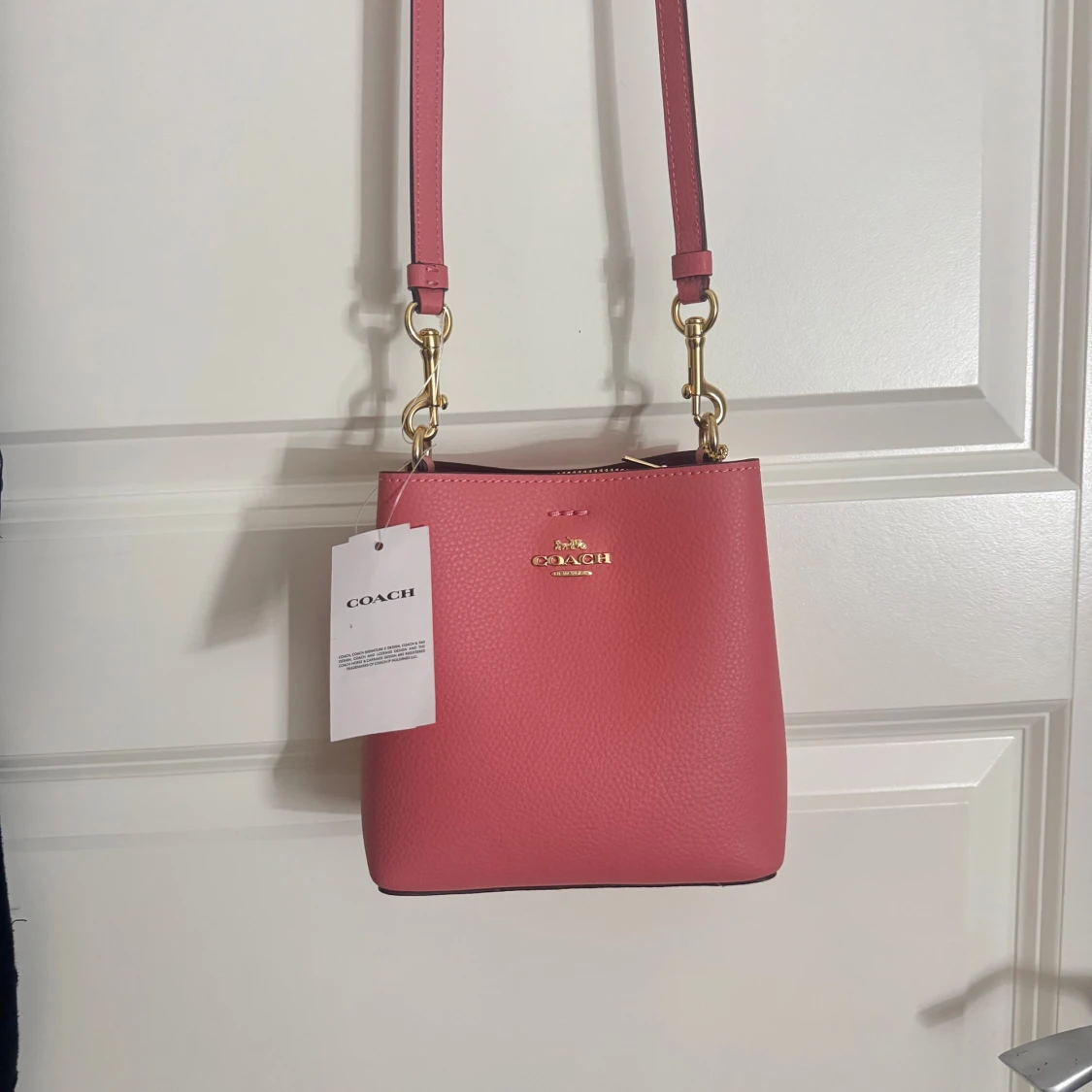 Rosa axelväska från Coach i skinn