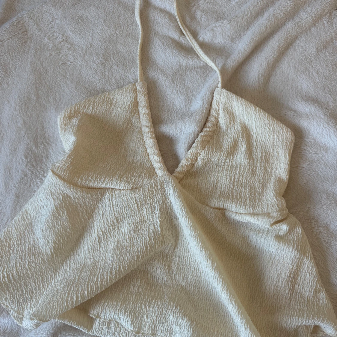 Krämvit halterneck linnetopp