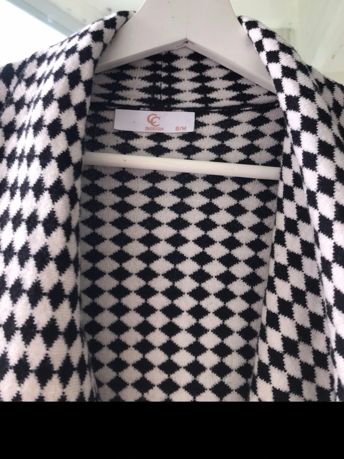 Svartvit rutig kappa med oversized passform - 2