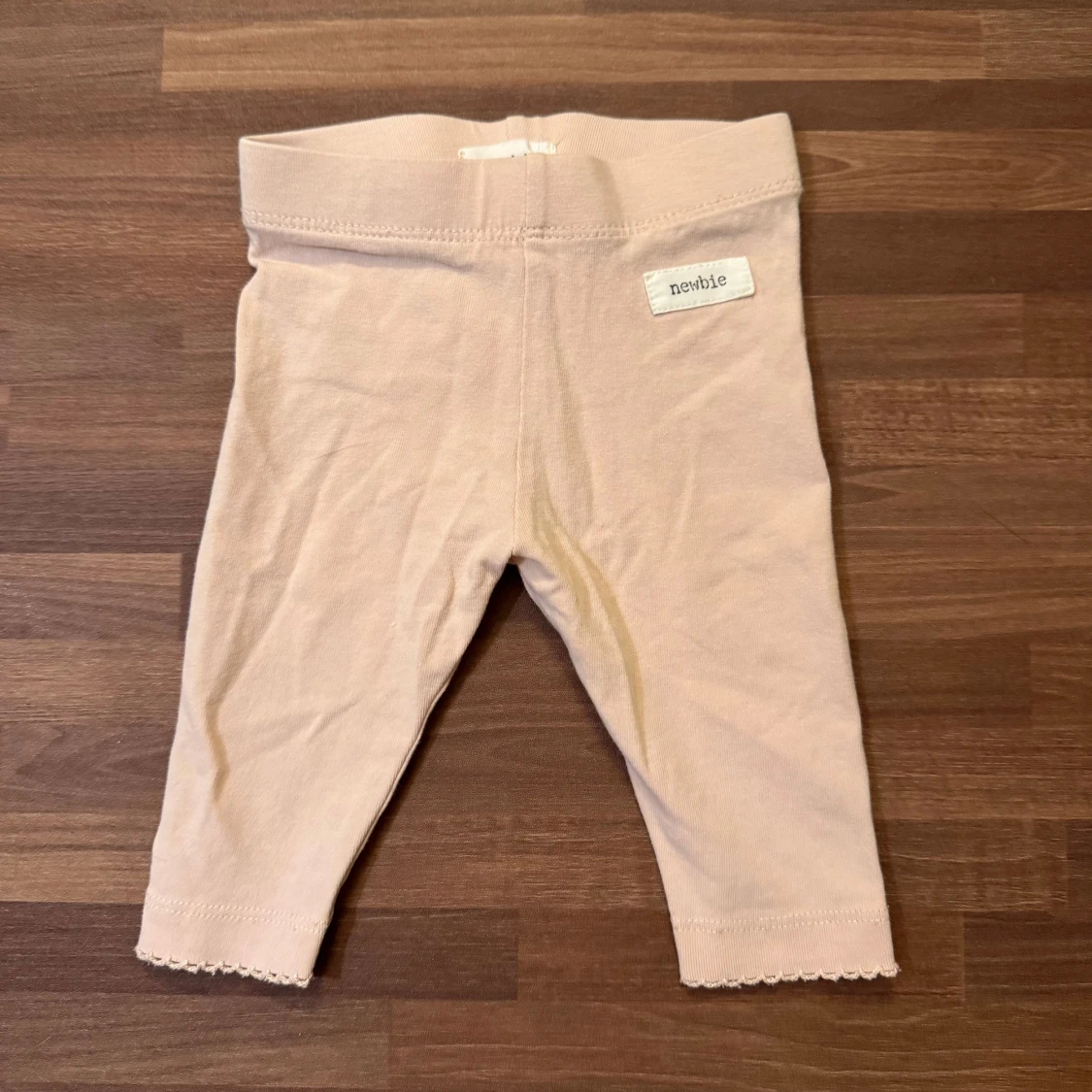 Ljusrosa leggings med rosett