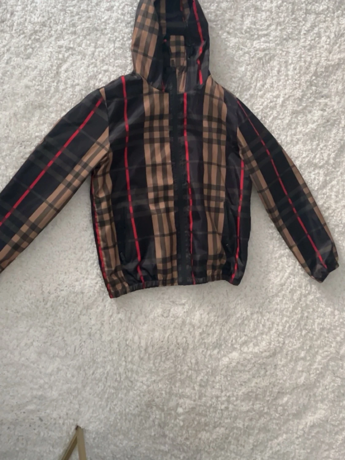 Brun-rutig vindjacka med huva