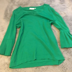 Grön tröja  - Fladdrig armar