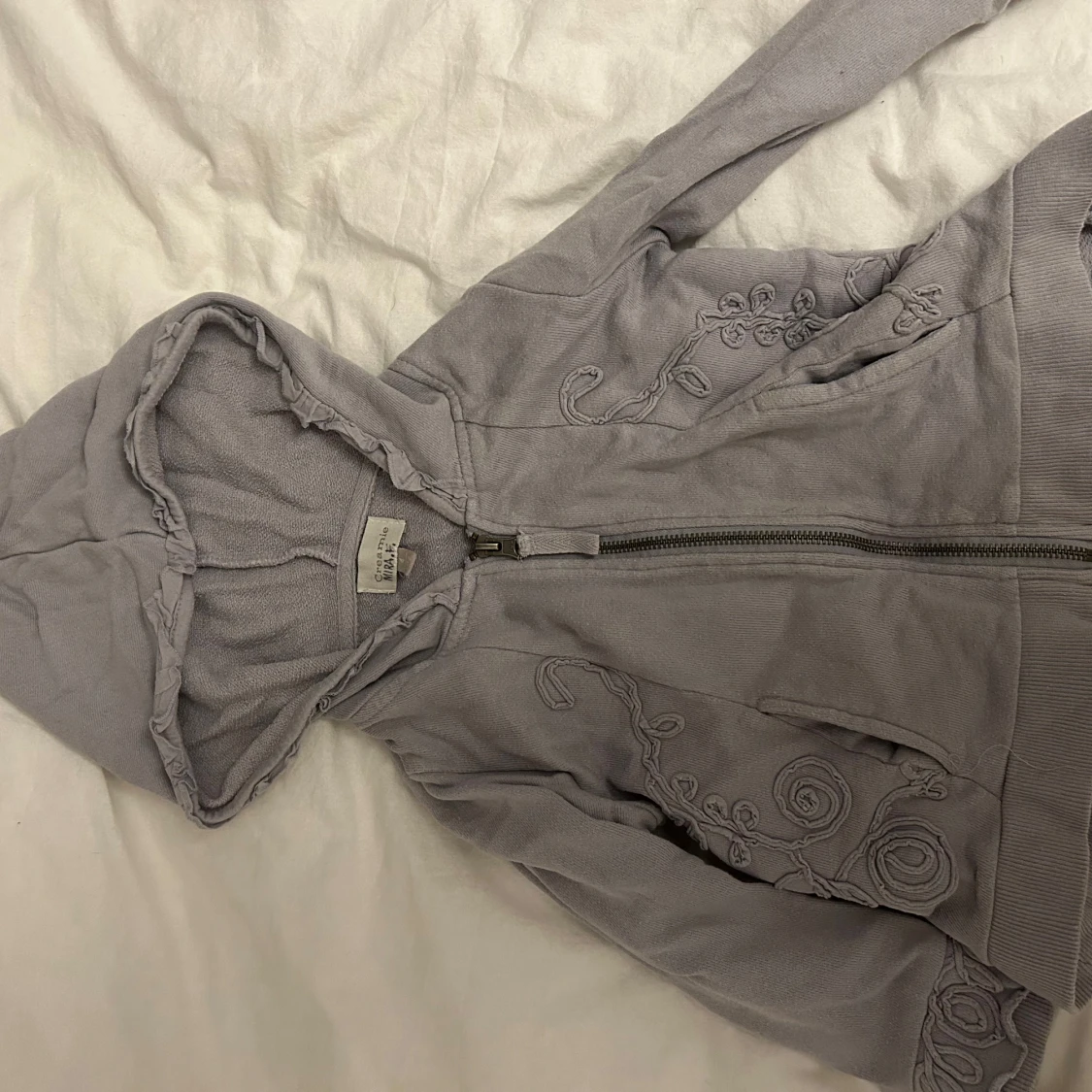 Lila zip up hoodie från Creamie