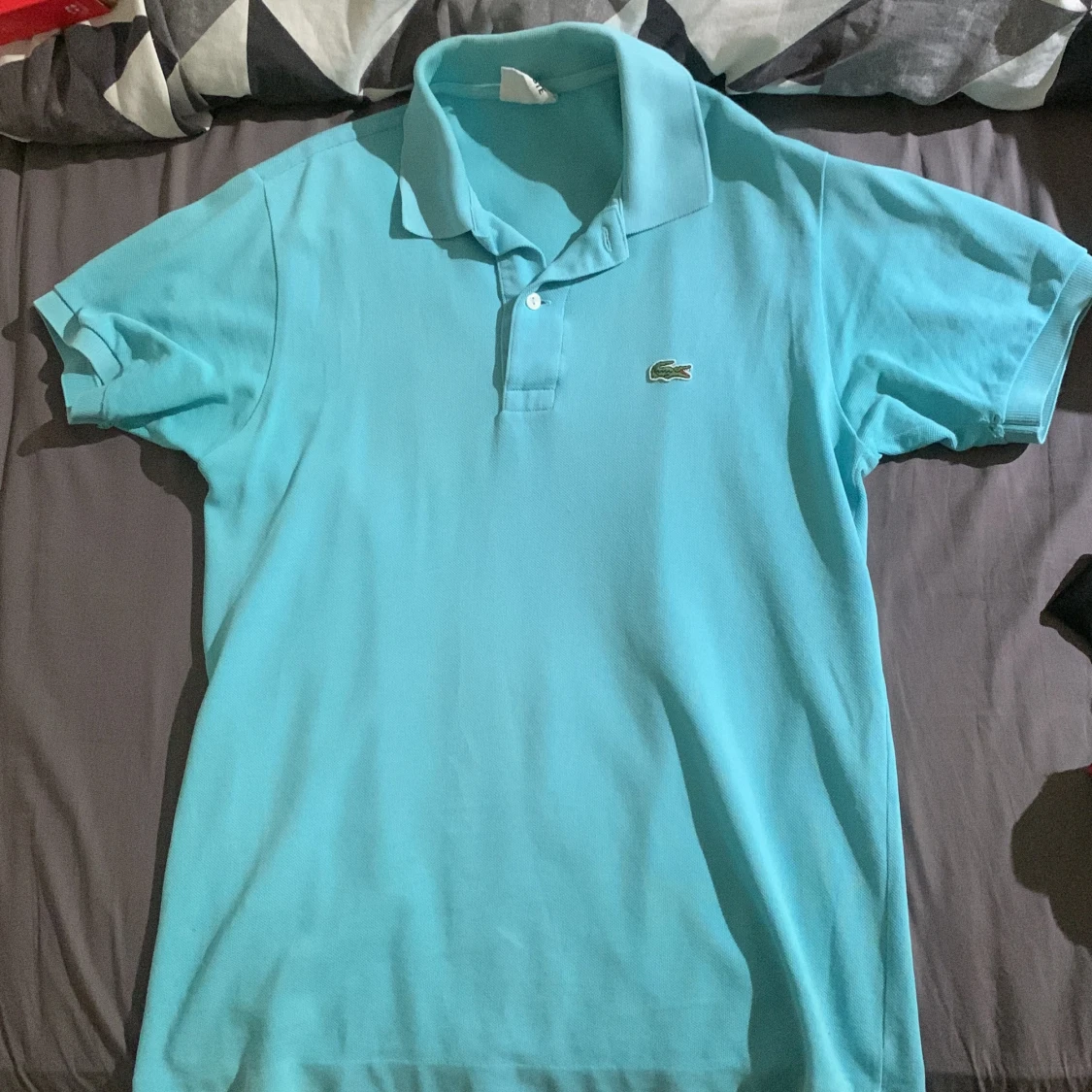 Turkos pikétröja från Lacoste