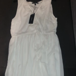 En vit kläning - Storlek XL