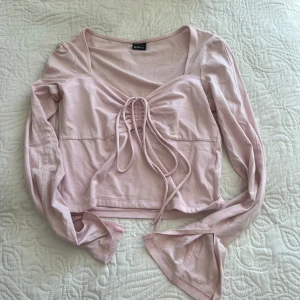 Rosa topp - Säljer denna rosa topp som aldrig används. Liten fläk men går att ta bort 