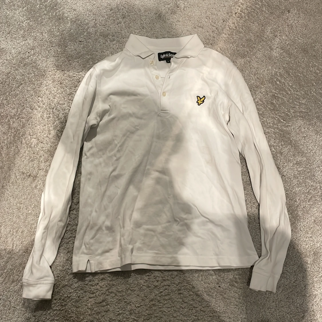 Vit långärmad pikétröja från Lyle & Scott