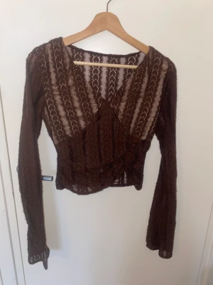 See through top - Brown see through top that’s unfortunately too small for my boobs :(. Very cute tho 
