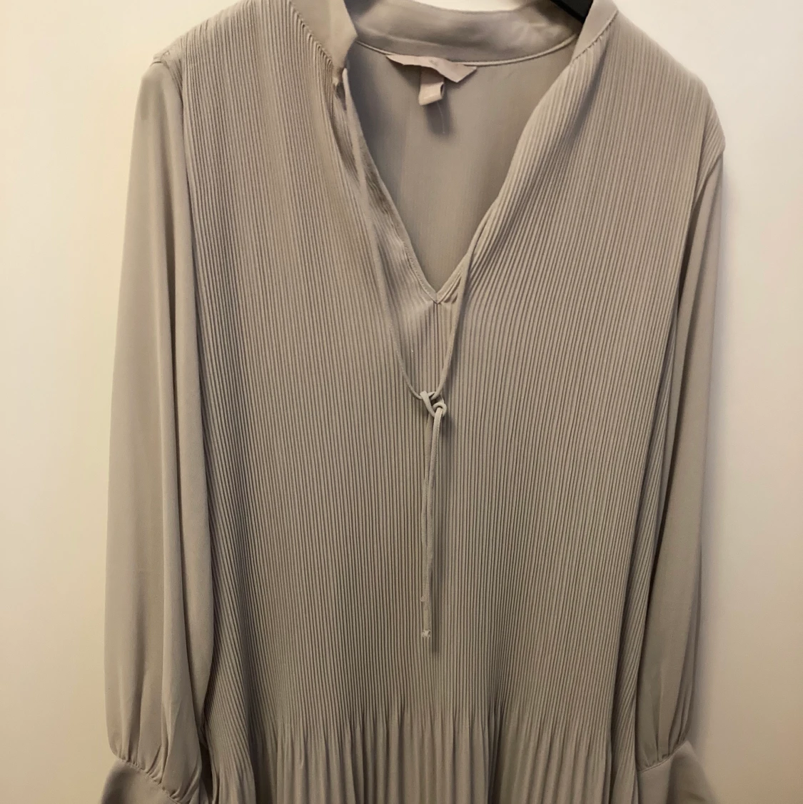 Plisserad klänning - 90