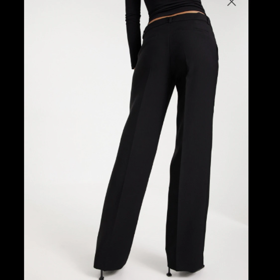 Svarta kostymbyxor