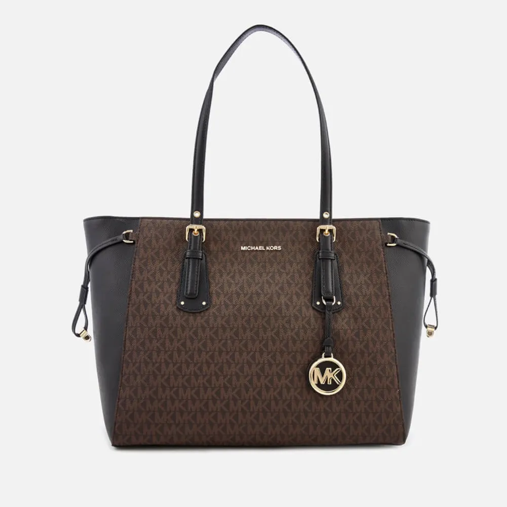 Säljer nu min Michael kors väska köpt för 3100kr priset kan diskuteras vid snabb affär brun svart med guldiga detaljer. Laukut & Käsilaukut.