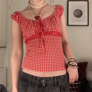 cute plaid checkered babydoll topp - super cute top!! has a tie at the front where you can make it looser or tighter, no tag but im a size xs/s and its stretchy 