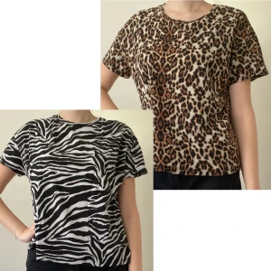 T-shirt från Lager 157 med zebra eller leopardmönster - 2 t-shirts från Lager 157 med zebra eller leopardmönster. Båda är i storlek M/L. Använd fåtal gånger därav nyskick. Säljer pga de inte kommer till användning. Köp 1 för 75kr eller båda för 125kr. 