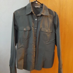 ProCam-Fis hiking shirt - Used but no damages.   Size is M but I bought it in Asia so I think it is more like a size S. Do contact me for more photos or if you have any questions.
