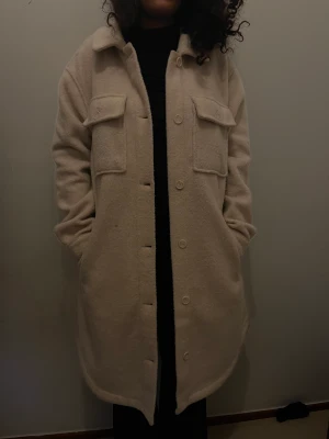 Beige kappa - Storlek M