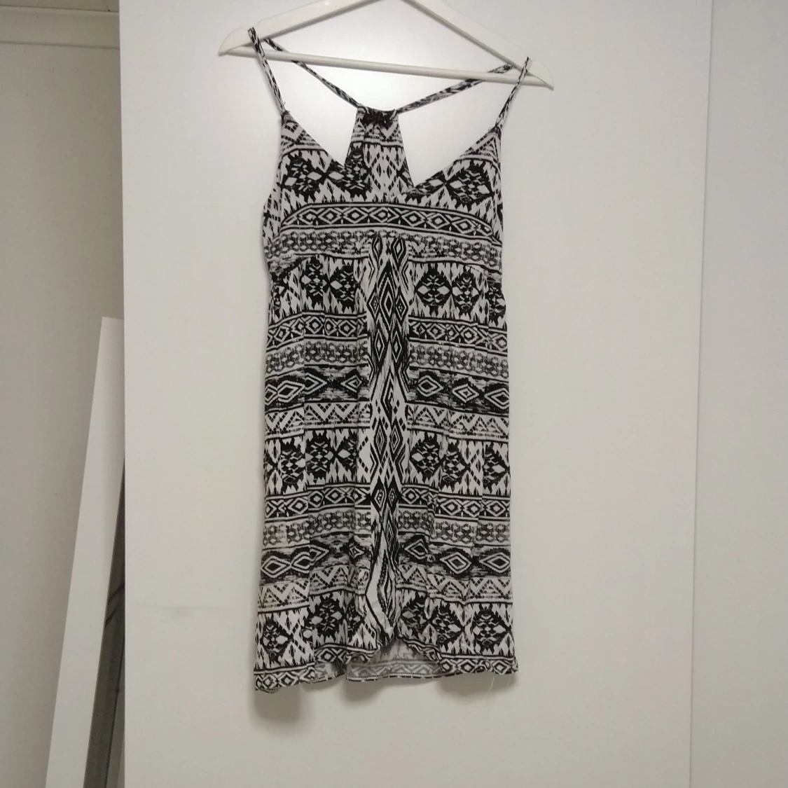 En somrig klänning i storlek 34 (xs).