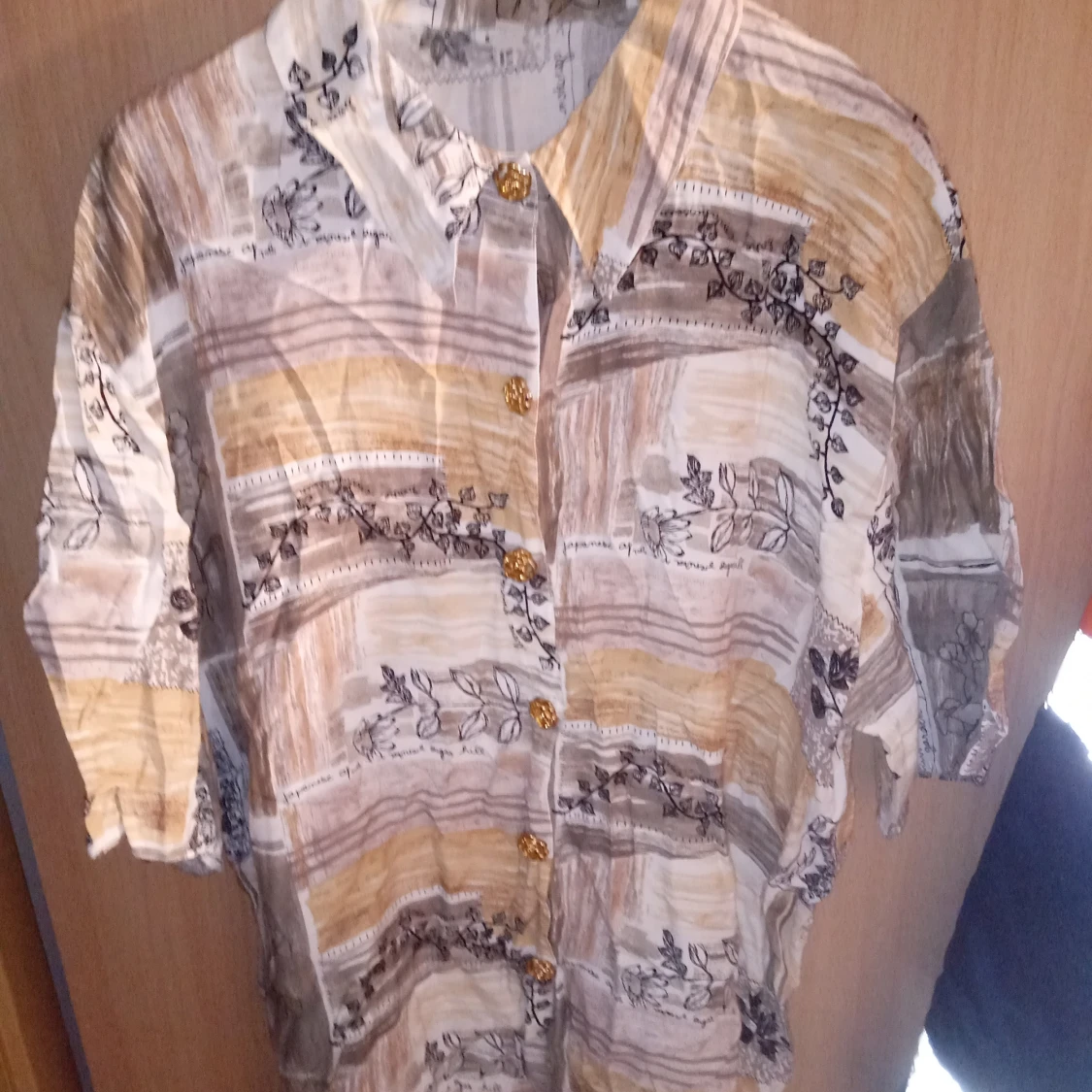 Blus mönstrad stl M /L. - 90