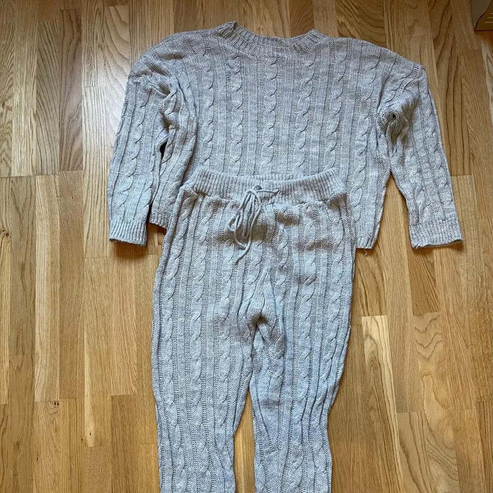 Matching set of  light gray sweater and pants in size M.  Almost new. . Stickat.
