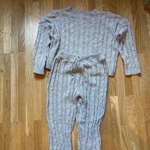 Matching set of  light gray sweater and pants in size M.  Almost new. 