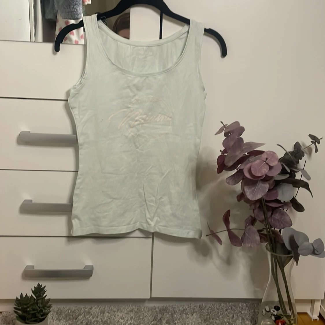 Ett Linne i färg ljusblå.