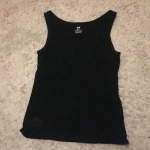 linne - Svart basic linne från hm i barnstorlek 158/164