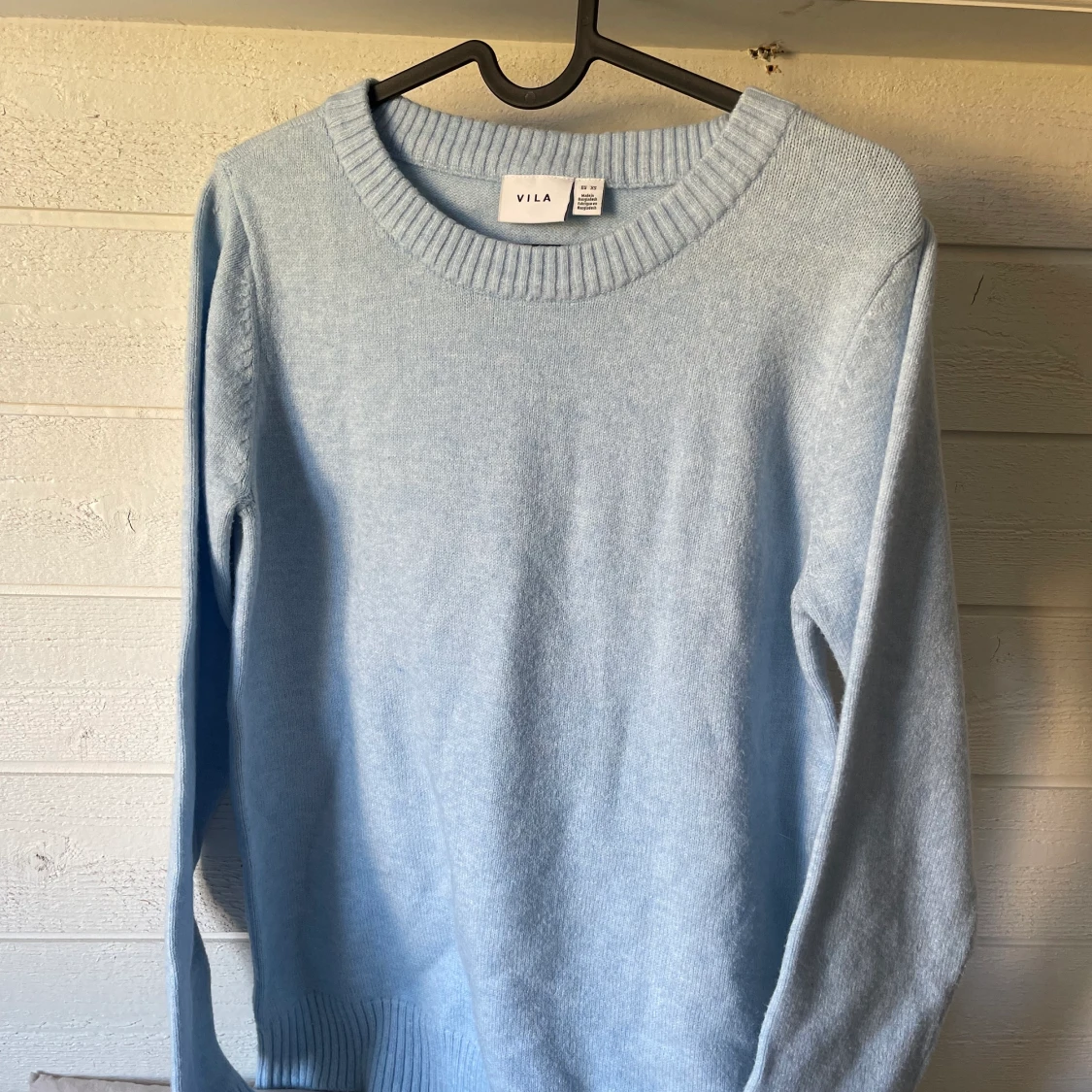 Ljusblå stickad tröja från salt 