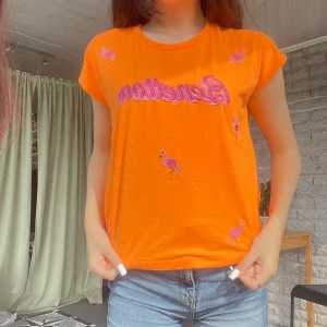 Orange bright tshirt  - Great for raves and festivals. Very bright. My sister has the same one so you can get them both together (is in the next ad)