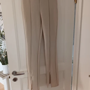 Beiga byxor - Storlek small