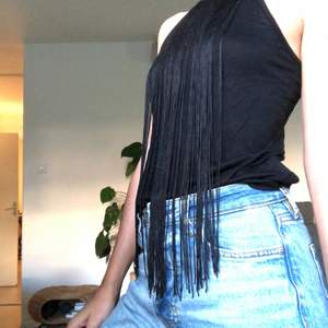 Black top with long fringes. Used only once. 