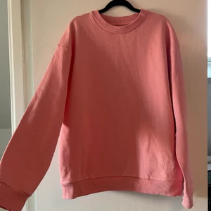 Oanvänd rosa college tröja - Snygg oanvänd rosa college tröja från lager 157. Storlek m (herrstorlek). Lapp kvar! Frakt tillkommer