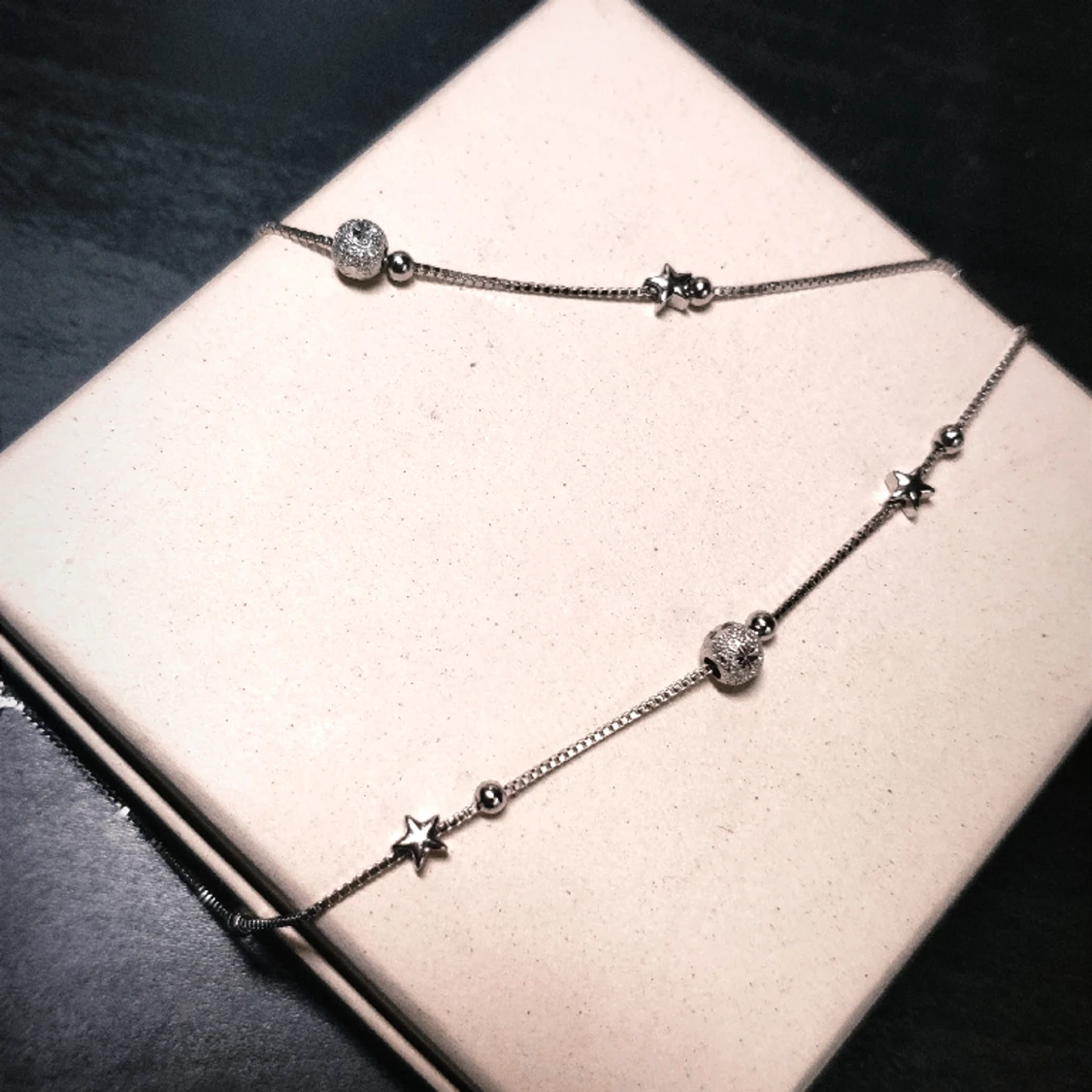 Dubbelkedjad silverarmband med stjärbor