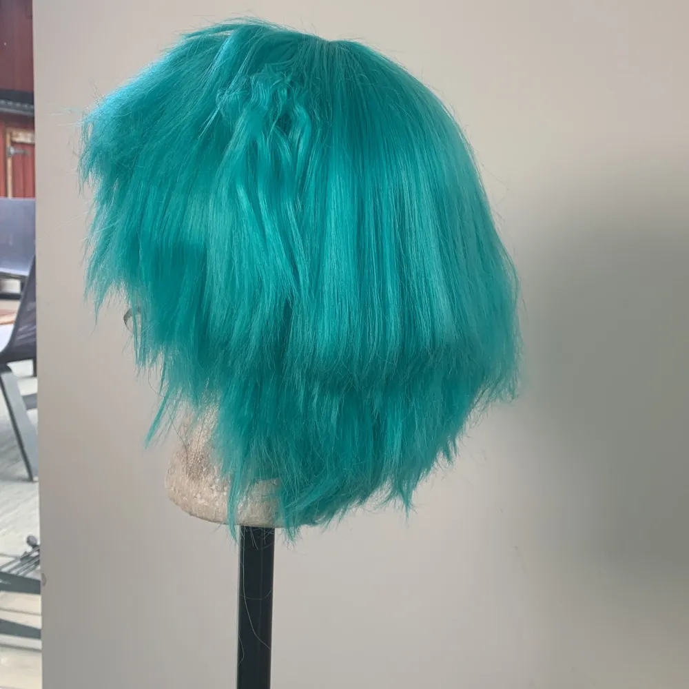 Originally a hatsune miku wig base, crimped parts can be straightend on sides, some choppy cuts. Accessoarer.