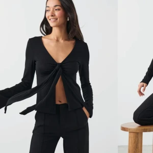 Tie front long sleeve top - Säljer denna ”doop” på design by si från Gina. Nypris:300, mitt pris 240 Aldrig använd endast provad❣️ Säljer då den aldrig blir använd💕