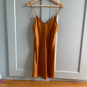 Minimalist Ginia Hand Dyed Caramel Silk Slip Dress  100% Silk  Adjustable Straps for the right fit.  Some naturally occurring discoloration, please appreciate for its character.  Very Good Condition  Model Is 160cm (5”3) And Generally Fits XS/S. 