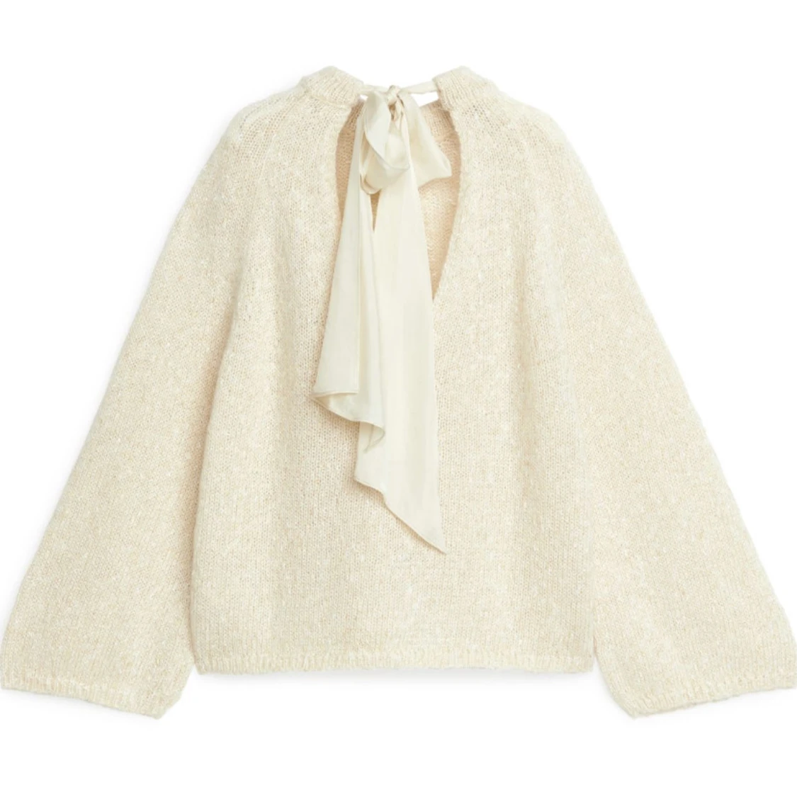 Stickad tröja med knyte