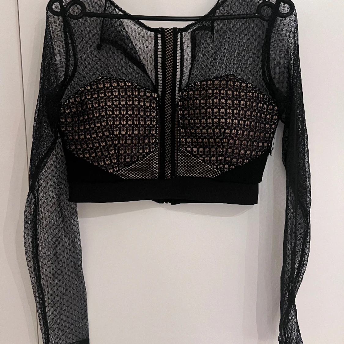 Kort tipp med genomskinlig nät armar