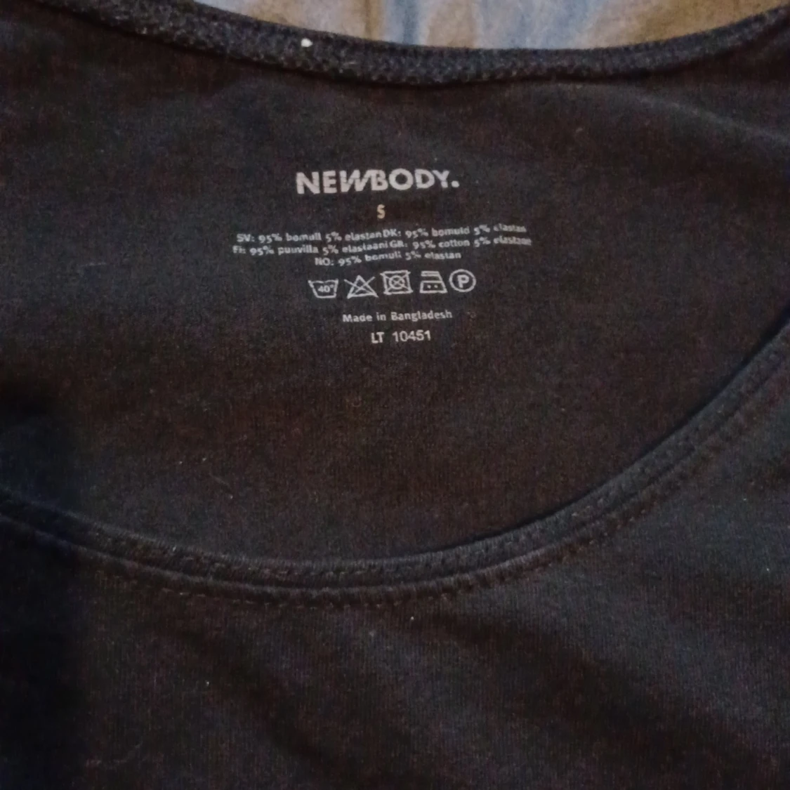 Ett linne med breda band - 91